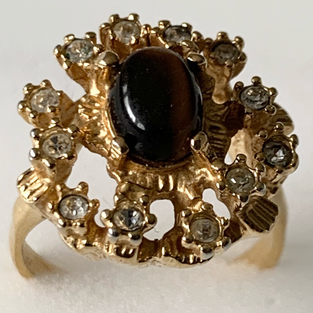 Gold plated vintage tigers eye stone with rhinestone.